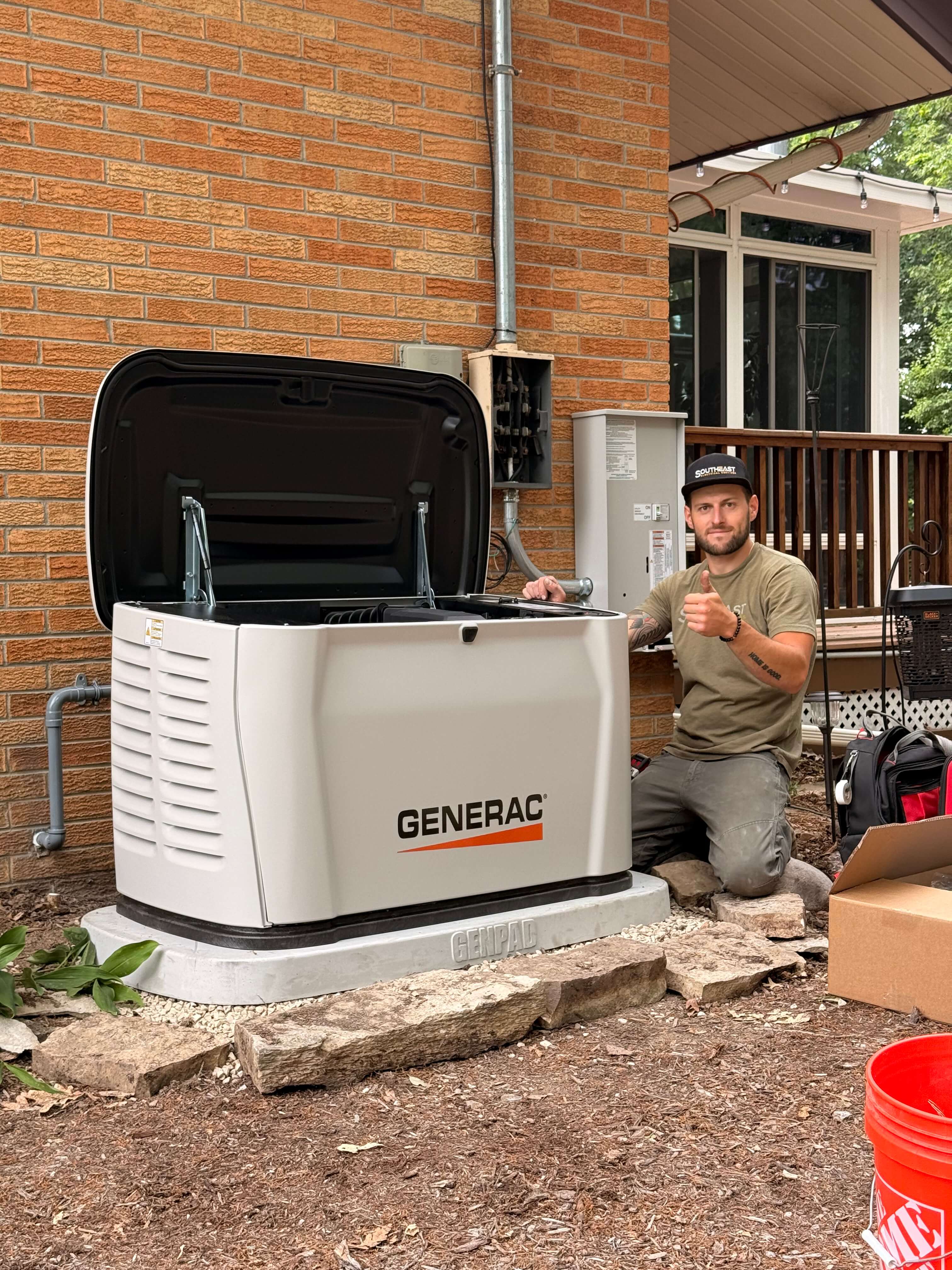 Southeast Electrical Services technician installing a Generac home standby generator